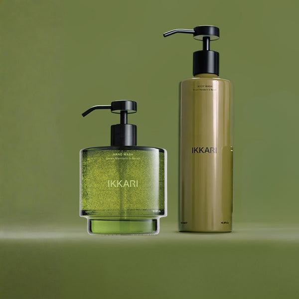 Two bottles of Ikkari hand wash on a green background